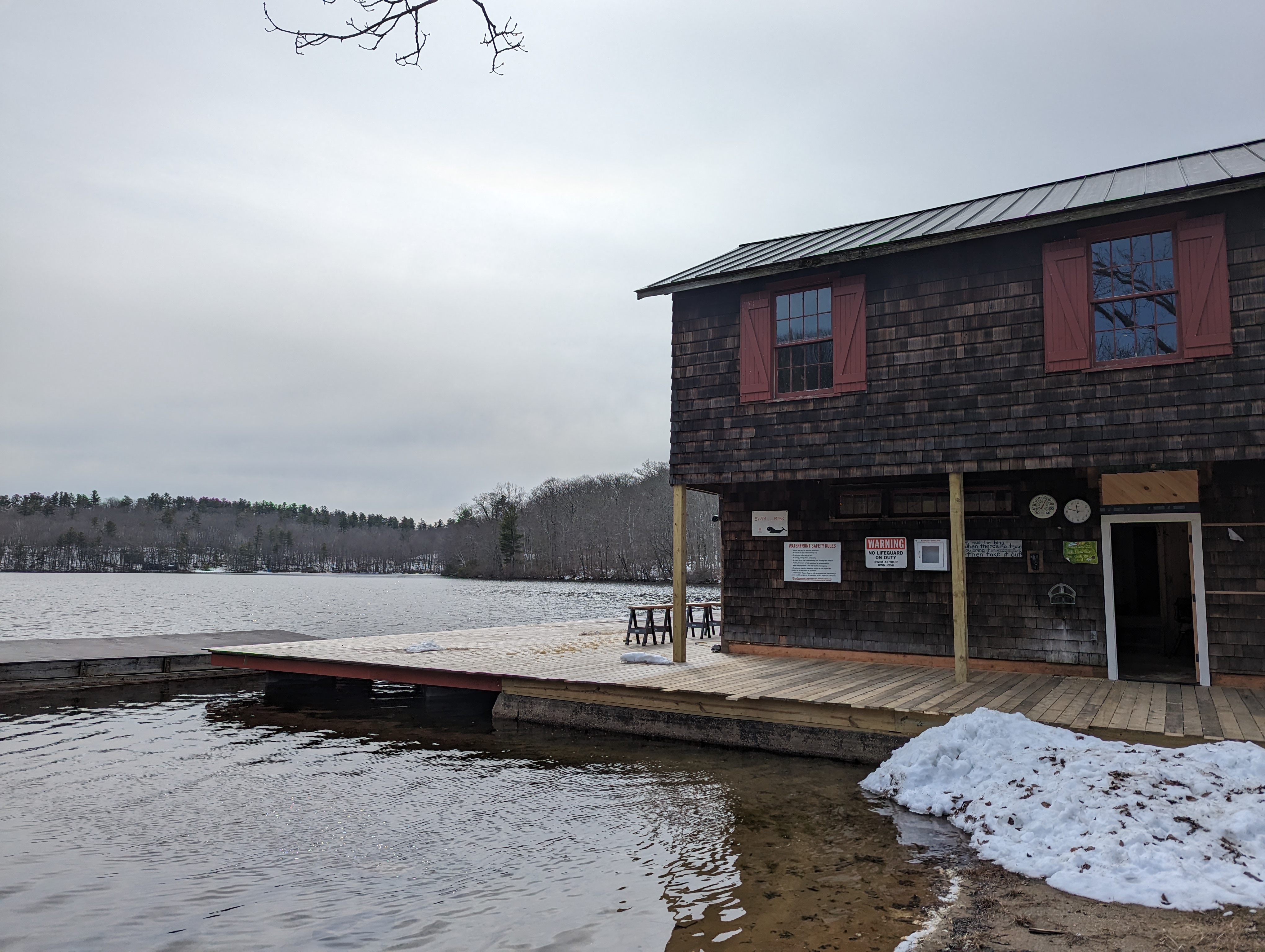 The CHLA clubhouse in winter, showing the cedar-shingled building and dock on Cream Hill Lake